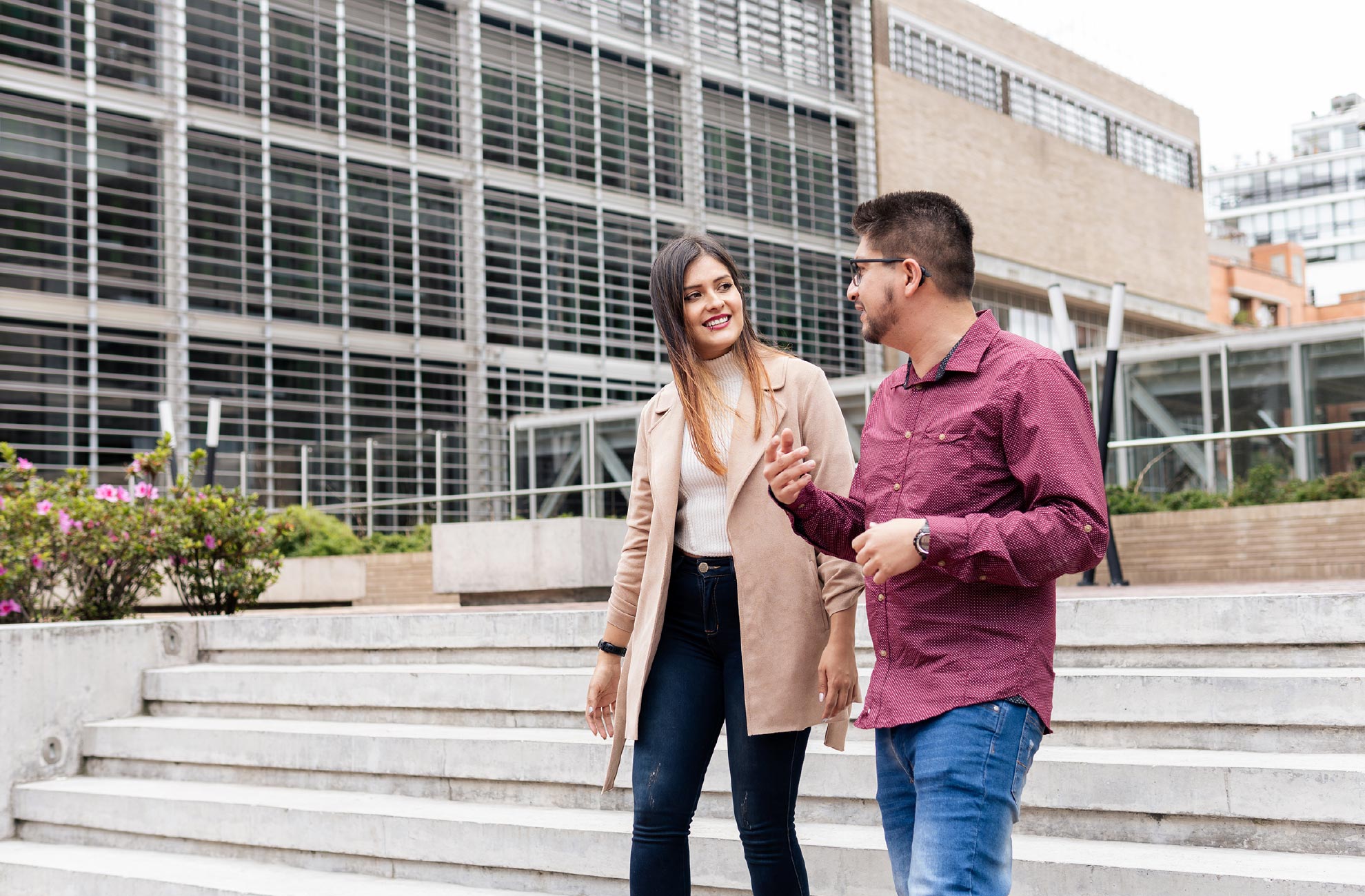 Photo: Two students walking on campus outdoors